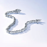 Emerald cut and rounds tennis bracelet