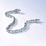 Emerald cut and rounds tennis bracelet