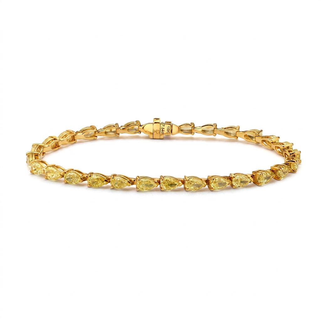 Yellow gold is the right choice here. It deepens the saturation of these pear cut yellow d — bracelet packshot, Full bracelet view