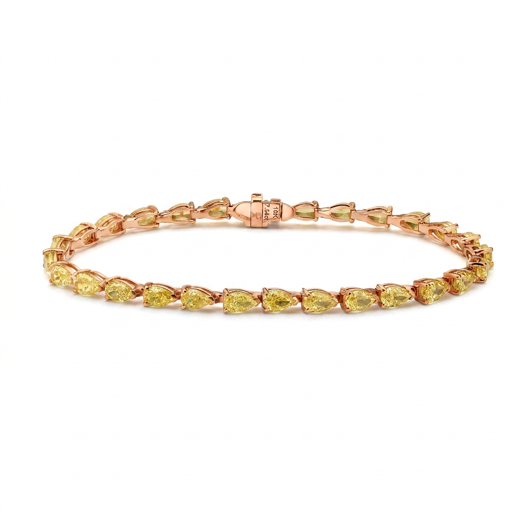Yellow gold is the right choice here. It deepens the saturation of these pear cut yellow d — rose gold bracelet, front view packshot