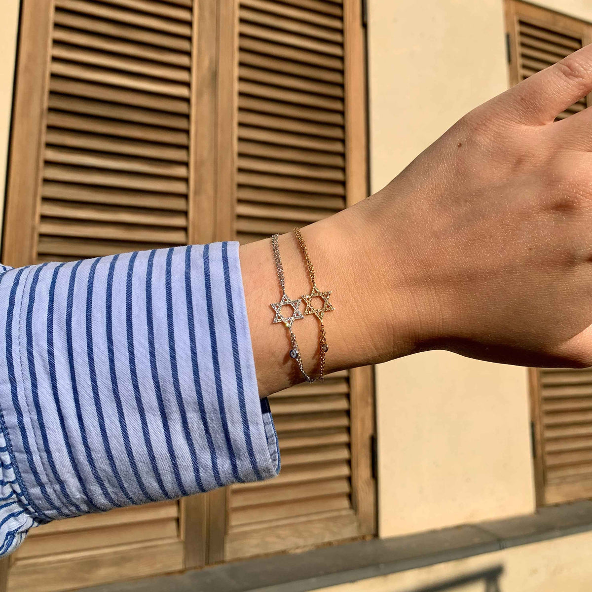 A hand wearing David Star Bracelet Fine Jewelry