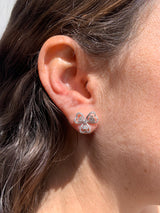 Lifesyle - Flower diamond earrings on ear in white gold
