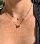 Diamond and Emerald Halo Necklace
