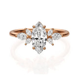 Exeptonal marquise diamond ring with smaller marquises on the band , resembling floating flower