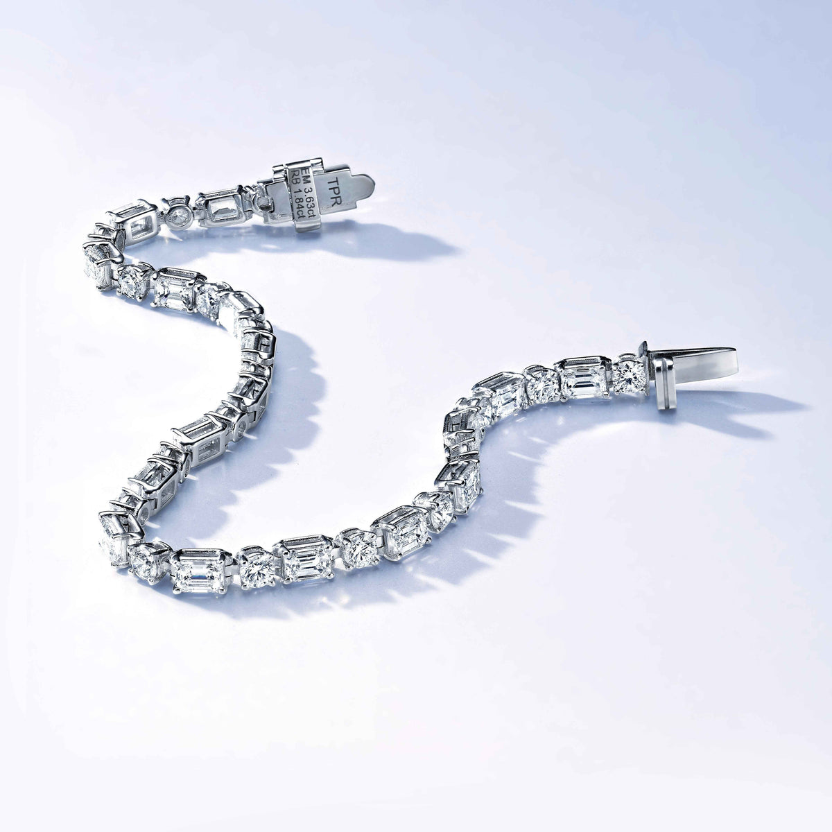 Emerald cut and rounds tennis bracelet