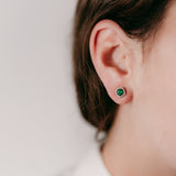 Lifestyle - Green Emerald and diamonds studs in rose gold 18k on ear 