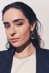 Lifestyle - snowflake earrings on ear in 18k Rose gold 